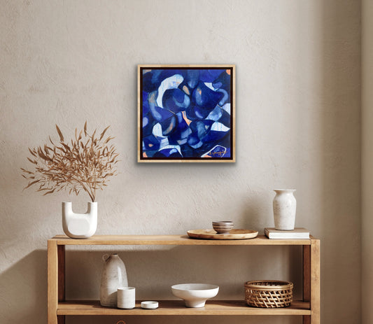 Original blue gallery abstract painting shown with sidetable